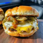 Double Cheeseburger-Stuffed Onion Bombs with Fiery Green Chilis & Smoky Chipotle Sauce
